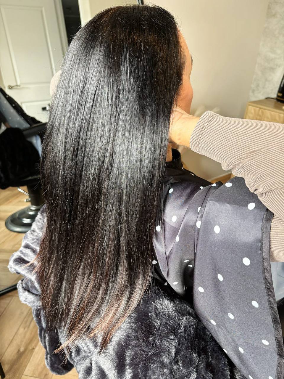 Long, blonde hair with tape extensions.